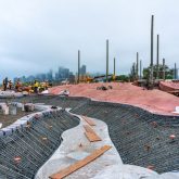 A valley made up of steel rebar with concrete down the centre.