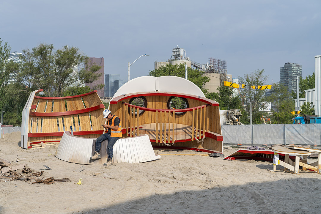 The face of the owl structure resting on the ground, seen from inside.