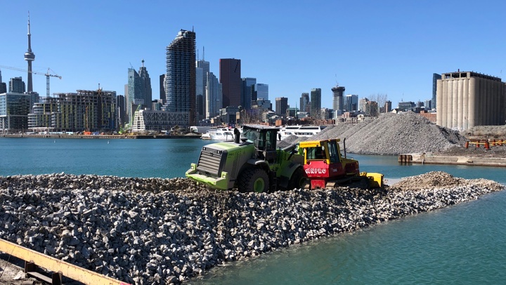 image of a truck and construction equipment on the quay
